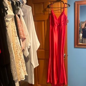 Formal red size 7/8 dress with slit. New with tags